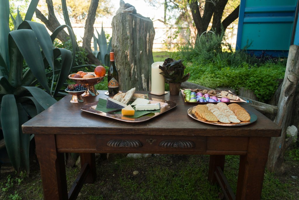 Sertodo Thessaly square copper platters serving food on an outdoor table