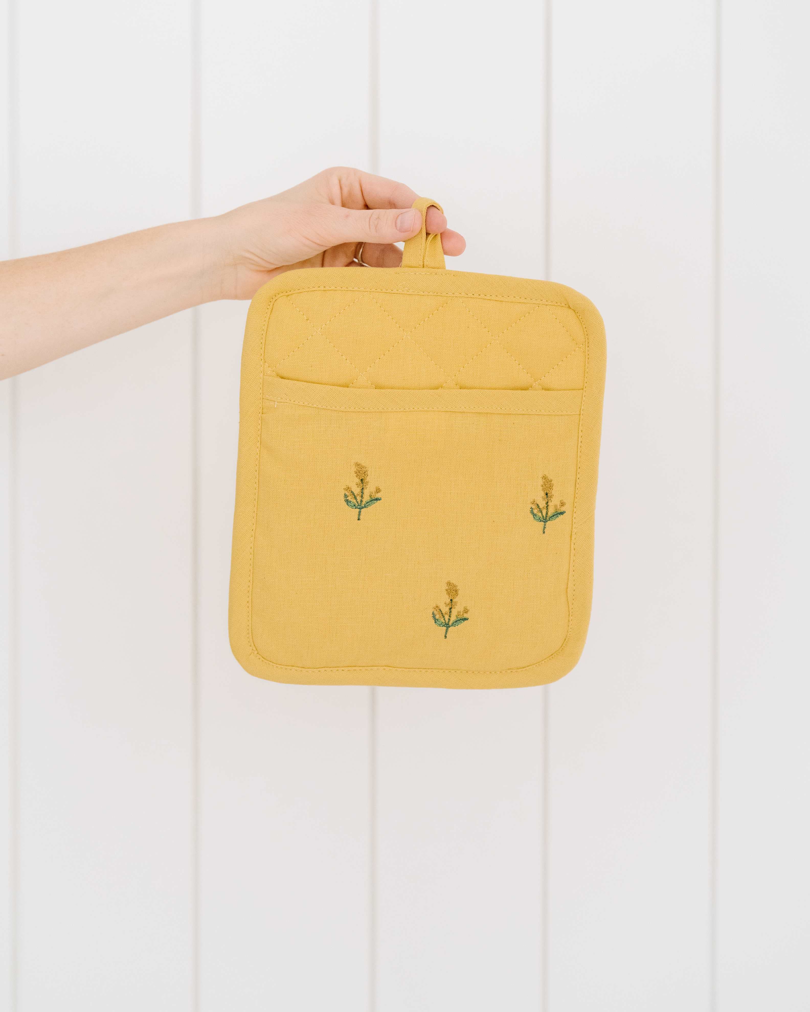 Gelber bestickter Topflappen