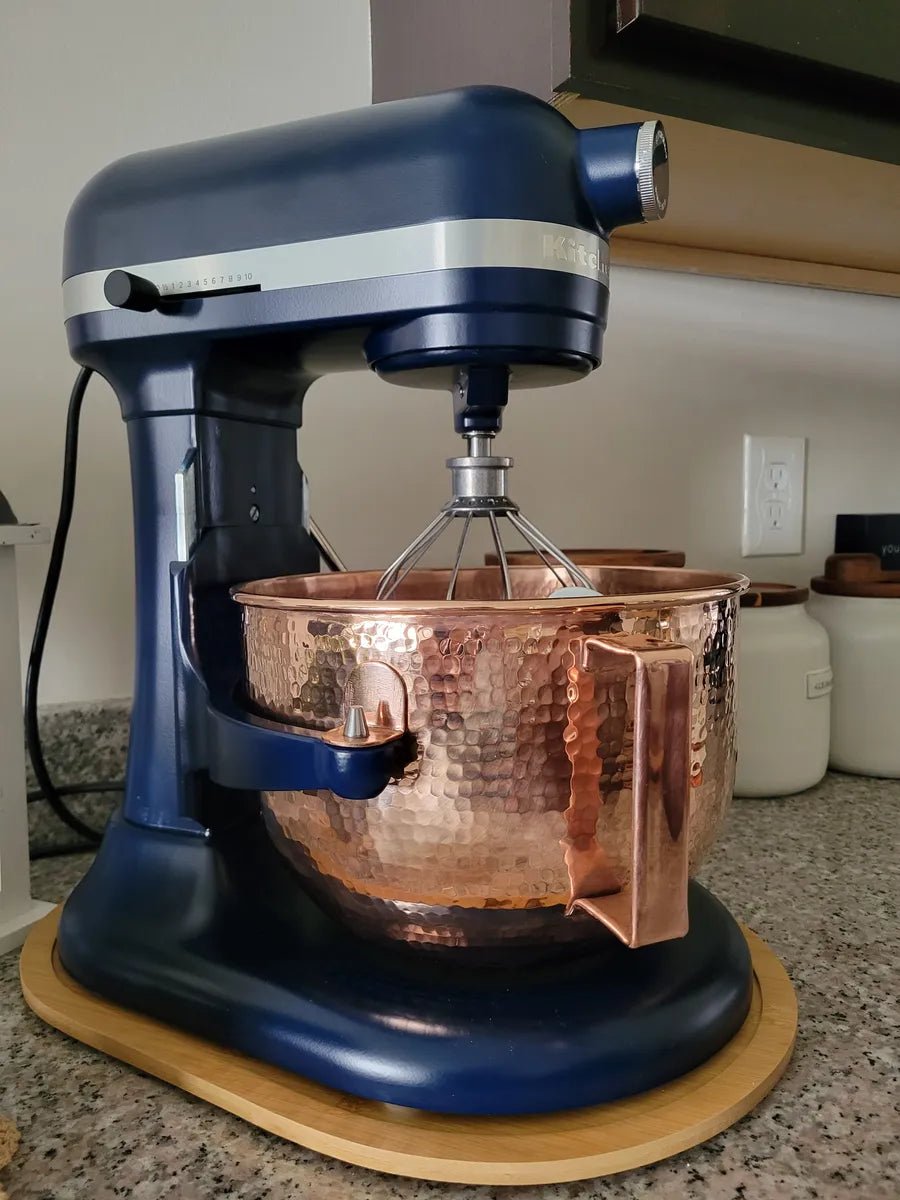 Sertodo copper mixing bowl fitted on a blue KitchenAid stand mixer