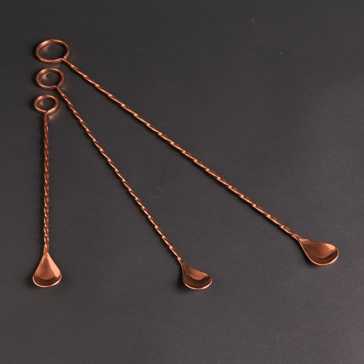 Three Sertodo Ringer copper bar spoons with twisted handles