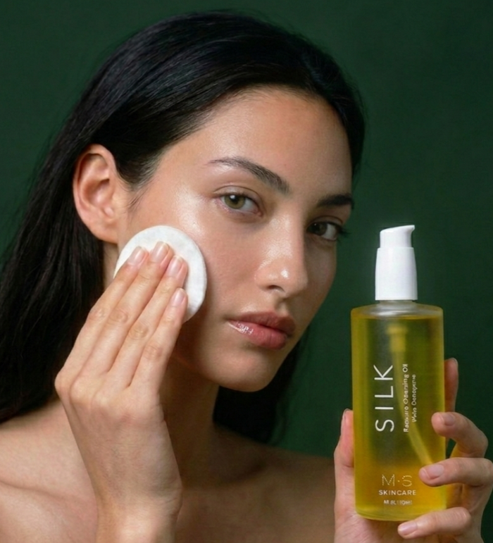 Woman Using Silk Oil Cleanser on face 