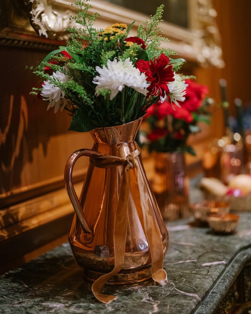 Galley & Fen copper heirloom vase with red and white flowers