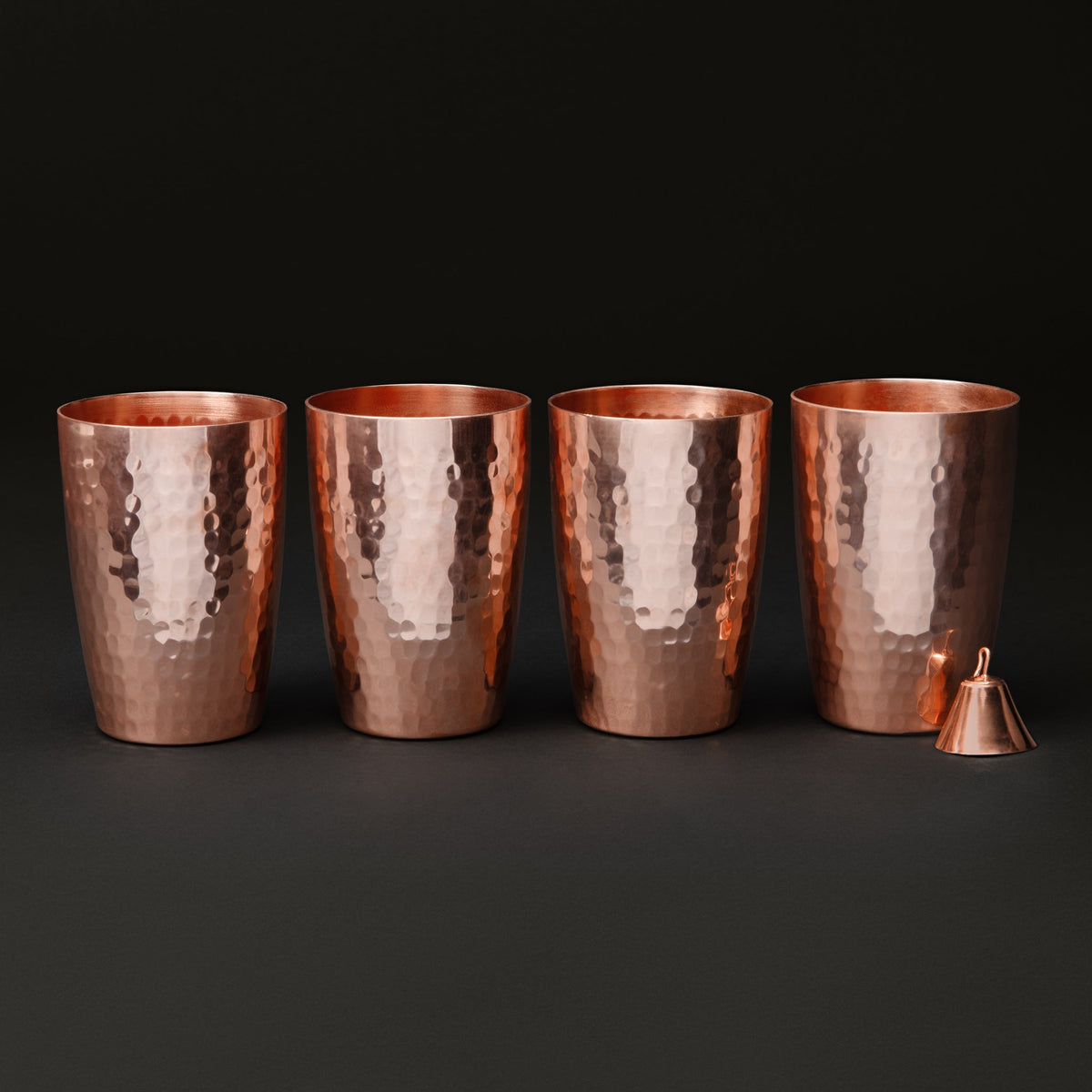 Four Sertodo Just Right copper cups with a small funnel