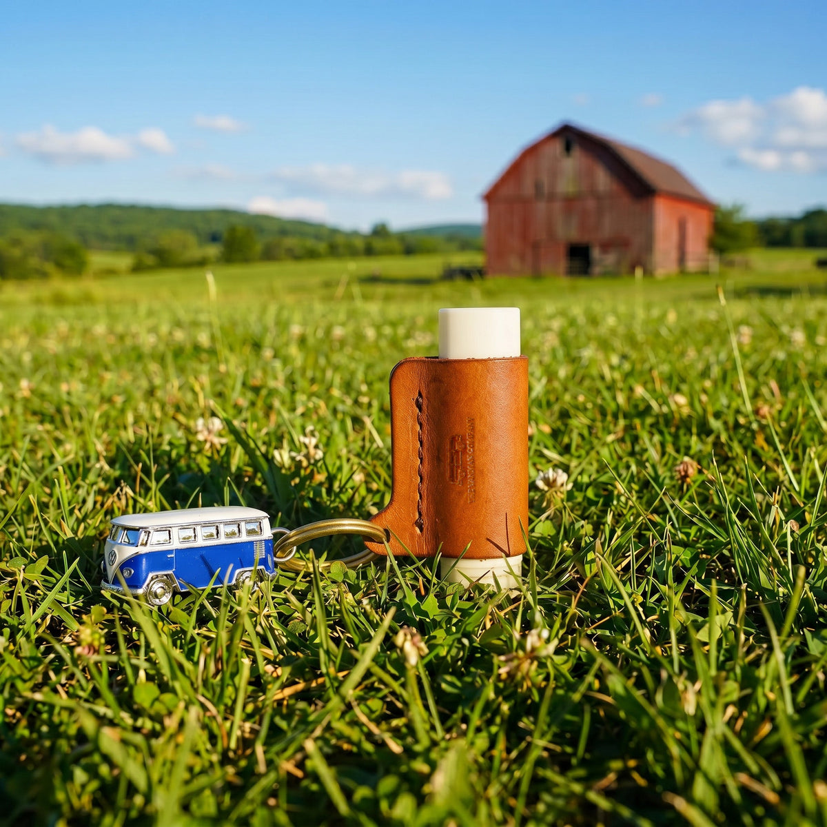VanMan's Leather Lip Balm Holder in brown leather with keyring, holding a lip balm