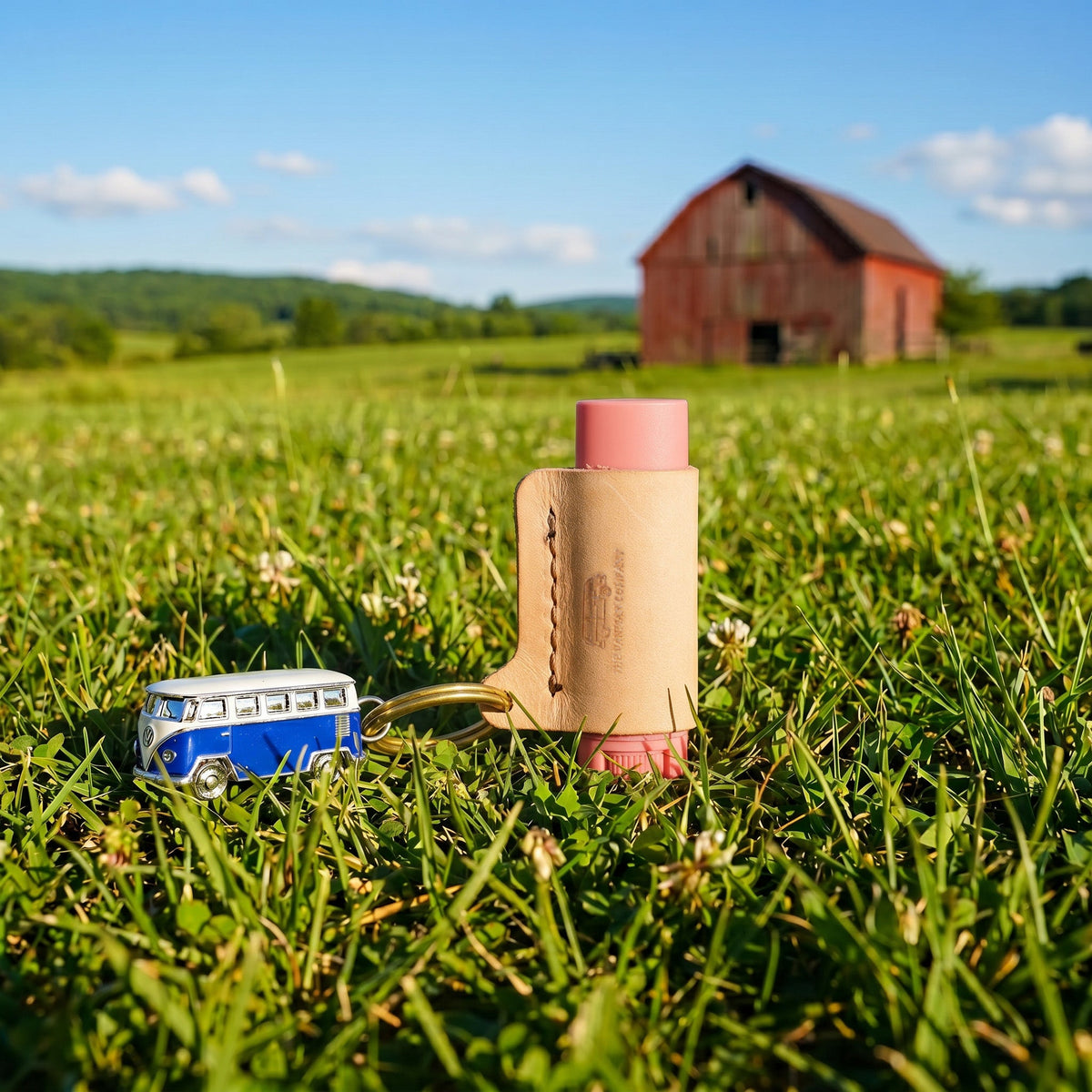 VanMan's Leather Lip Balm Holder in natural leather with keyring, holding a lip balm