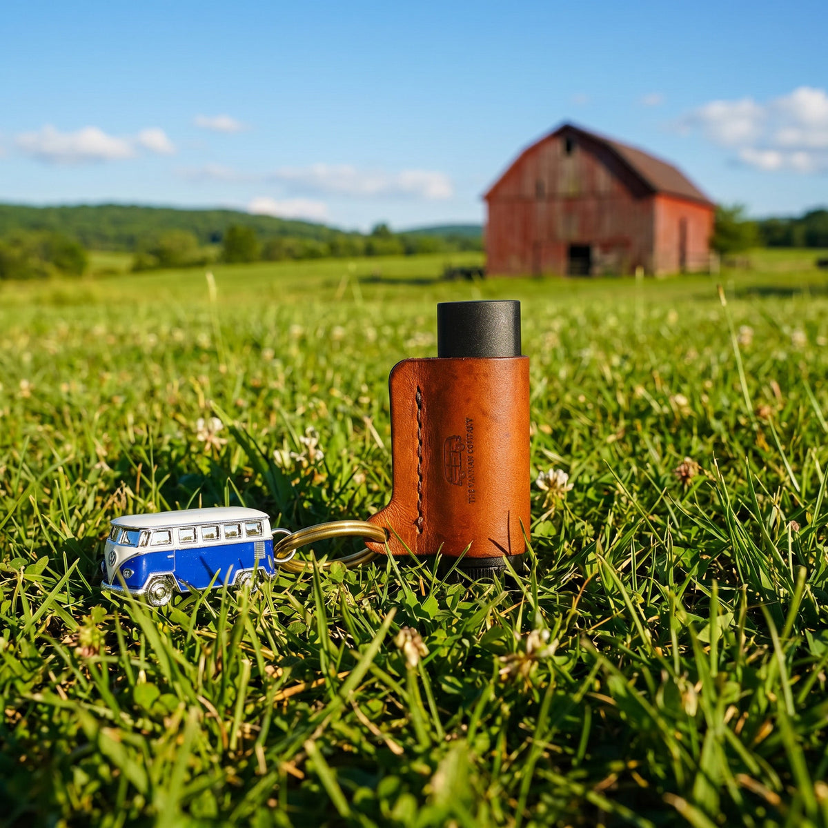 VanMan's Leather Lip Balm Holder in dark brown leather with keyring, holding a lip balm