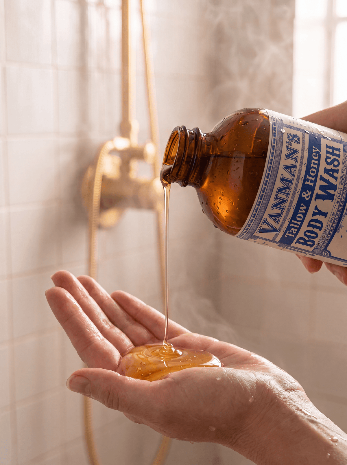 VanMan's Tallow & Honey Body Wash poured into a hand in the shower